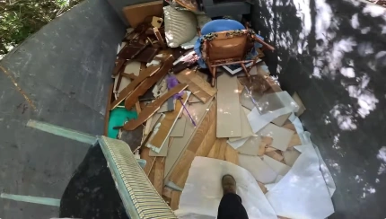 Aerial view of a loaded dump trailer full of furniture and debris after a Haverhill junk removal job